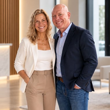Dave and DeeAnn Stelzl in a modern office lobby Dave and DeeAnn Stelzl in a modern office lobby